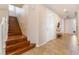 Welcoming entryway featuring tile flooring, staircase, and access to other living areas at 7321 Aspire Ct, Las Vegas, NV 89113