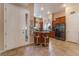 Modern kitchen featuring tile flooring, breakfast bar, and stainless steel appliances at 7321 Aspire Ct, Las Vegas, NV 89113