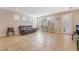 Bright living room with tile floors, neutral walls, and windows providing natural light at 7321 Aspire Ct, Las Vegas, NV 89113