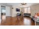 Inviting living room with sleek furniture, ceiling fan, and wood-look flooring at 7321 Aspire Ct, Las Vegas, NV 89113