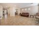 Expansive living room with tile flooring, recessed lighting, and neutral color palette at 7321 Aspire Ct, Las Vegas, NV 89113