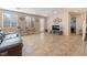 Bright living room with tile floors, neutral walls, and windows providing natural light at 7321 Aspire Ct, Las Vegas, NV 89113