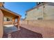 Covered patio and gravel backyard with a view of the house at 7337 Tealwood St, Las Vegas, NV 89131