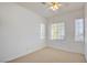 Well-lit bedroom with neutral carpeting and large windows at 7337 Tealwood St, Las Vegas, NV 89131