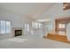 Bright living room featuring hardwood floors, a fireplace, and high ceilings at 7337 Tealwood St, Las Vegas, NV 89131