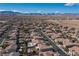 Aerial view of homes with desert landscape and mountain backdrop at 7435 Sun Summit Ct, Las Vegas, NV 89178