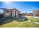 House backyard with grass, stone pathway, and pergola at 7435 Sun Summit Ct, Las Vegas, NV 89178