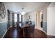 Formal dining room with dark wood table and statement wall decor at 7435 Sun Summit Ct, Las Vegas, NV 89178