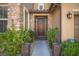 Ornate front door with decorative iron gate and landscaping at 7435 Sun Summit Ct, Las Vegas, NV 89178