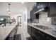 Kitchen with granite countertops and dark cabinetry at 7435 Sun Summit Ct, Las Vegas, NV 89178