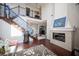 Elegant living room with fireplace and a stunning staircase at 7435 Sun Summit Ct, Las Vegas, NV 89178