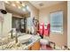 Bathroom boasts granite countertops and modern vanity at 7666 Rainbow Cove Dr, Las Vegas, NV 89131