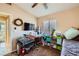 Well-lit bedroom featuring a workspace and built-in shelving at 7666 Rainbow Cove Dr, Las Vegas, NV 89131