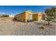 Landscaped front yard with brick walkway and desert plants at 7666 Rainbow Cove Dr, Las Vegas, NV 89131