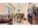 Bright kitchen nook with a small table, chairs, and large window at 7666 Rainbow Cove Dr, Las Vegas, NV 89131