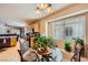 Kitchen nook with a round table, chairs, and window seating at 7666 Rainbow Cove Dr, Las Vegas, NV 89131