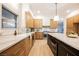 Contemporary kitchen featuring an island with seating and plenty of cabinet space at 7695 Silver Wells Rd, Las Vegas, NV 89149