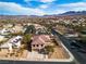 This is an aerial view of a beautiful home in a lush community with stunning mountain views at 790 Tossa De Mar Ave, Henderson, NV 89002