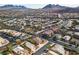 This aerial view showcases the desirable neighborhood location with mature trees and well-maintained streets at 790 Tossa De Mar Ave, Henderson, NV 89002