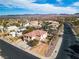 This is an aerial view of a beautiful home in a lush community with views of the stunning mountains at 790 Tossa De Mar Ave, Henderson, NV 89002