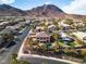 This is an aerial view of a lovely home showcasing a refreshing pool and mountain views at 790 Tossa De Mar Ave, Henderson, NV 89002