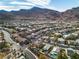 This aerial view captures the home's prime location with stunning mountain views in a vibrant community at 790 Tossa De Mar Ave, Henderson, NV 89002