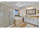 Bright bathroom with a soaking tub, glass shower, and double vanity at 790 Tossa De Mar Ave, Henderson, NV 89002