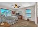 Cozy bedroom with natural light, a ceiling fan and comfortable furnishings at 790 Tossa De Mar Ave, Henderson, NV 89002