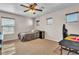 Cozy carpeted bedroom featuring a ceiling fan, blinds, and neutral tones at 790 Tossa De Mar Ave, Henderson, NV 89002