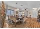 Bright dining room features modern chandelier, seating for eight, and elegant décor at 790 Tossa De Mar Ave, Henderson, NV 89002