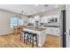 Bright kitchen featuring white cabinets, granite countertops, and a center island with seating at 790 Tossa De Mar Ave, Henderson, NV 89002