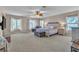 Spacious main bedroom with neutral carpeting, ceiling fan, and ample natural light at 790 Tossa De Mar Ave, Henderson, NV 89002