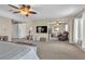 Expansive main bedroom featuring carpet, seating, a tv, and multiple rooms at 790 Tossa De Mar Ave, Henderson, NV 89002