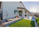 Backyard view of the water feature, covered patio, landscaping and home at 864 Firestone Ledge Ave, Henderson, NV 89012