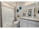 Modern bathroom features a glass enclosed shower, granite counters, and decorative accents at 864 Firestone Ledge Ave, Henderson, NV 89012