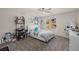 Bedroom featuring comfortable bed, a hanging chair, and a window at 864 Firestone Ledge Ave, Henderson, NV 89012