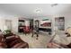 Comfortable living room includes a media center, snack bar and recessed lighting at 864 Firestone Ledge Ave, Henderson, NV 89012