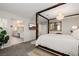 Bright primary bedroom with canopy bed and ensuite bathroom with double sinks and quartz countertops at 864 Firestone Ledge Ave, Henderson, NV 89012