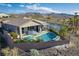 Aerial view of the property with a private pool, patio area, and scenic mountain views in the background at 91 Alta Cascata Pl, Henderson, NV 89011