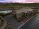 Aerial view of a single-story home with desert landscaping, and a brick driveway at 91 Alta Cascata Pl, Henderson, NV 89011