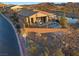 Aerial view of the property featuring a pool, outdoor seating, and well-maintained landscaping in a serene neighborhood at 91 Alta Cascata Pl, Henderson, NV 89011