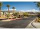 Gated community entrance with palm trees and desert landscaping in a desirable neighborhood at 91 Alta Cascata Pl, Henderson, NV 89011