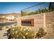 Community entrance sign amidst desert landscaping, creating a welcoming ambiance at 91 Alta Cascata Pl, Henderson, NV 89011