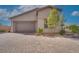 Attractive home exterior with a paved driveway and lush landscaping for enhanced curb appeal at 91 Alta Cascata Pl, Henderson, NV 89011