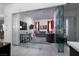 Living Room with glass-enclosed entrance, gray sofa, patterned chair, and neutral color palette at 91 Alta Cascata Pl, Henderson, NV 89011