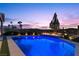 Beautiful backyard pool with integrated fire pit and mountain views at 91 Alta Cascata Pl, Henderson, NV 89011