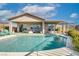 Backyard view showcasing the refreshing pool, patio furniture, and inviting outdoor space for entertaining at 91 Alta Cascata Pl, Henderson, NV 89011