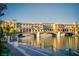 Picturesque waterfront buildings with charming architecture reflected in the calm water at 91 Alta Cascata Pl, Henderson, NV 89011