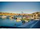 Scenic view of a waterfront recreation area with boats, jet skis and covered docks at 91 Alta Cascata Pl, Henderson, NV 89011