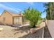 Landscaped backyard with gravel and desert plants at 9101 Dolphin Cove Ct, Las Vegas, NV 89117